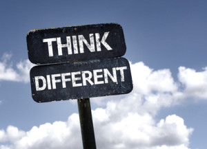Think Different sign with clouds and sky background